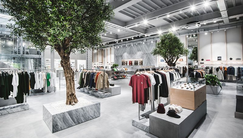 A lively look without limits: the flagship Manchester business of the clothing dealer End with artificial olive trees.